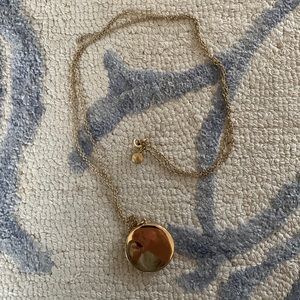 Long chain gold locket necklace